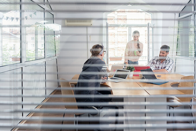 young independent workers sharing the facilities of a modern co-working space